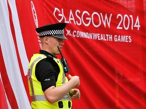 A police officer patrols the perimeter of the Commonwealth Games facilities in advance of the games’ opening on Wednesday. (Reuters)
