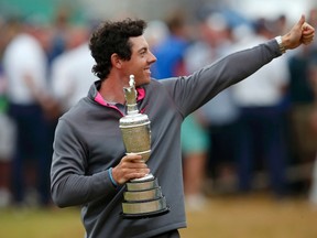 Northern Ireland’s Rory McIlroy holds the Claret Jug after winning the British Open on Sunday. (REUTERS)