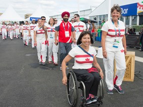 Canada's chef de mission, Chantal Peticlerc — shown here during Canada's welcome ceremony Monday in Glasgow — has won multiple Paralympic gold medals in her career. (Dan Galbraith, Details Group)