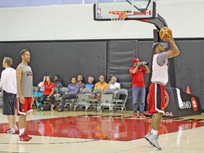 Veteran Lakers point guard and Team Canada GM Steve Nash watches as Spurs guard Cory Joseph takes a shot during practice yesterday the Air Canada Centre. (BASKETBALL CANADA PHOTO)