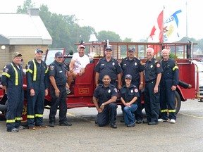 CHRIS ABBOTT/TILLSONBURG NEWS
'Grandpa Bob' Facca, escorted to Tillsonburg by firefighters from Norfolk Fire and Rescue Services, Station 6 (Courtland) met Tillsonburg Fire and Rescue Services at the Norfolk Mall Saturday afternoon. Facca, who is raising money for Duchenne muscular dystrophy with a 4,000 km walk from Quebec City to Winnipeg, walked to the Metro in Tillsonburg for a fundraising barbecue sponsored by the Delhi-LaSalette Knights of Columbus.