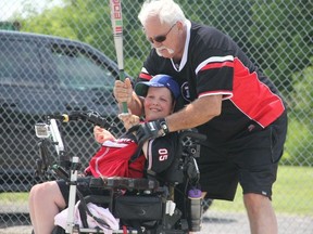 Bryce Desrochers and his grandfather Marcel Manta play baseball at the Notre Dame Deschamps field on Navan Rd. An Ottawa group is asking for people to vote online so it can win $100,000 toward a playground and baseball diamond for disabled kids in Ottawa. (Submitted image ROSEMARY THOMPSON)