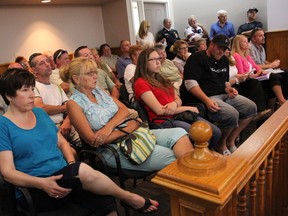 Many locals gathered for the Strathroy-Caradoc council public meeting  July 21 were Mt. Brydges  residents opposed a rezoning of two properties on Railroad Street requested by Holman’s Welding Limited. A decision on the issue was deferred by council.ELENA MAYSTRUK/ AGE DISPATCH/ QMI AGENCY