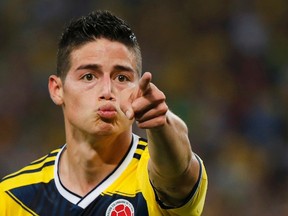 Colombia's James Rodriguez celebrates after scoring against Uruguay during their 2014 World Cup round of 16 game at the Maracana stadium in Rio de Janeiro in this June 28, 2014 file photo. (REUTERS)