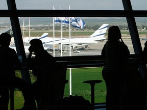 People sit inside Israel's Ben-Gurion International Airport near Tel Aviv in a January 5, 2010 file photo. (REUTERS/Ronen Zvulun/files)