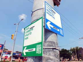 Signs showing how long it takes to walk to nearby attractions have been popping up around Sarnia. A QR code can be scanned and offers directions. (BRENT BOLES / THE OBSERVER / QMI AGENCY)