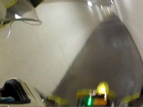 A screengrab from video shows a motorcyle joyriding through the underground tunnels at Carleton University. Police are investigating the stunt, which was posted to YouTube, then pulled down. (Image via YouTube)