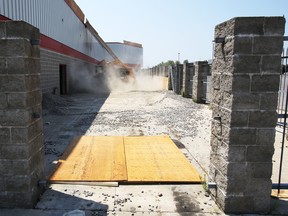 Demolition teams have started tearing away frontage of the former Zellers location on Bell Boulevard in Belleville, Ont. to get the site ready for a host of retailers. (Tuesday, July 22, 2014) - Jerome Lessard/The Intelligencer/QMI Agency
