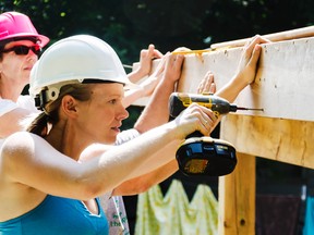 Rachael Huibers was one of many women who jumped on board and lent a helping hand to Habitat for Humanity during Women's Build Week in Picton at 7 York Street. Belleville On. Tues. July 22, 2014. Lacy Gillott/TheIntelligencer/QMI Agency