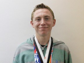 17-year-old Frank Maddock Student Royden Radowits proudly displays three of the medals he’s won for running this year prior to heading to Montreal for the 2014 Canadian Junior Nationals Championship.