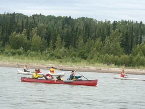 Paddlers and passengers prepare for their ride on July 19.