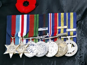 Rain-soaked war medals.
 Clifford Skarstedt/Peterborough Examiner/QMI AGENCY