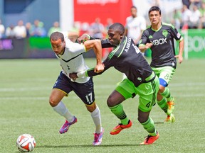Tottenham Hotspur’s Andros Townsend and Seattle Sounders’ Jalil Anibaba fight for the ball during their friendly on Saturday. (USA TODAY SPORTS)