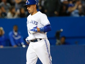 Ryan Goins reaches the plate on April 17, 2014, after his only home run (and RBI) of his first 24 games as a Blue Jay in 2014. After spending time at triple-A Buffalo, Goins was recalled by the Blue Jays on July 22, 2014. (STAN BEHAL/Toronto Sun files)