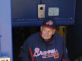 Atlanta Braves manager Bobby Cox walks from the clubhouse into the dugout for his final home regular-season game on Oct. 3, 2010. On July 27, 2014, he walks into the Baseball Hall of Fame. (TAMI CHAPPELL/Reuters files)