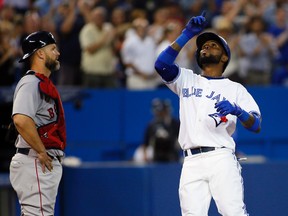 Toronto Blue Jays shortstop Jose Reyes celebrates his home run in the sixth inning as Boston Red Sox catcher David Ross looks on at the Rogers Centre on July 22, 2014. (John E. Sokolowski/USA TODAY Sports)