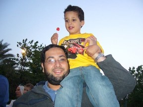 Khaled Al-Qazzaz, seen here in an undated Facebook photo with his son Abdelrahman on his shoulder.