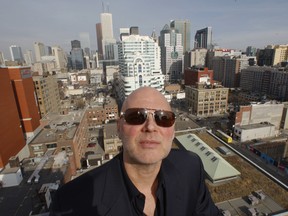 Brad J. Lamb of Brad J. Lamb Realty Inc. poses atop a terrace in a two-storey unit at his newly designed condominium at King St. W. and Spadina Ave. called GLAS.