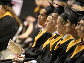 Grande Prairie Composite High School graduates listen as they are delivered a speech from their principal, Dr. David Brecht (not pictured) during their cap and gown ceremony on Friday, May 23. High school graduation rates in the area have been taxed by the ongoing economic boom. JOCELYN TURNER/DAILY HERALD-TRIBUNE/QMI AGENCY