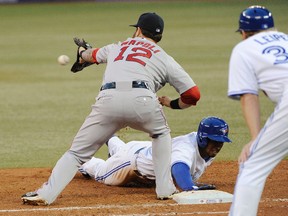 Boston Red Sox first baseman Mike Napoli catches the ball on a pickoff attempt as Anthony Gose of the Toronto Blue Jays dives back to the bag at Rogers Centre on July 23, 2014. (PETER LLEWELLYN/USA TODAY Sports)