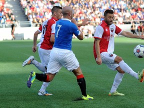 Ottawa Fury FC midfielder Sinisa Ubiparipovic cdefends the balls from an attacking Glasgow Ranger. DEAN JONCAS PHOTOGRAPHY