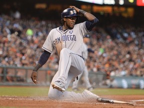 San Diego Padres center fielder Cameron Maybin (24) scores on a ground out by right fielder Will Venable (25, not pictured) against the San Francisco Giants during the fifth inning at AT&T Park on June 24, 2014 in San Francisco, CA, USA (Kyle Terada/USA TODAY Sports)