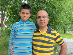 Jimmy Hassan with his son Daud, 10.
