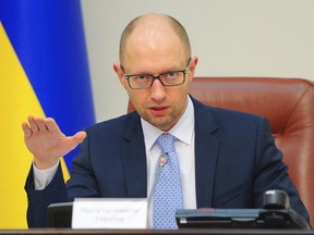 Ukraine's Prime Minister Arseny Yatseniuk speaks during a government meeting in Kiev, June 25, 2014. (REUTERS/Andrew Kravchenko/Pool)