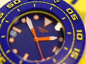 A Swatch Scuba Playero wristwatch is displayed in a shop in Zurich in this July 23, 2013 file photo. REUTERS/Arnd Wiegmann/Files