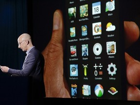 Amazon CEO Jeff Bezos shows off the 3D features of his company's new Fire smartphone at a news conference in Seattle, Washington June 18, 2014. REUTERS/JASON REDMOND
