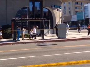 Robert Kovacik posted a video clip of a woman in labour sitting on bench to wait for U.S. President Barack Obama’s motorcade to pass on a street in Los Angeles on Wednesday. (robertnbcla/Instagram)