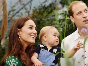The Duchess of Cambridge carries Prince George alongside Prince William as they visit the Sensational Butterflies exhibition at the Natural History Museum in London, July 2, 2014.   REUTERS/John Stillwell/Pool