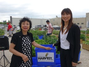 Emmie Leung (left) and her daughter Paulina of Emterra Group at a press conference. Emterra announced it was donating $60,000 over three years to Winnipeg Harvest. (Daria Zmiyiwsky/Winnipeg Sun)