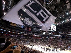 The Los Angeles Kings celebrate after defeating the New York Rangers 3-2 in double overtime of Game 5 to win the 2014 Stanley Cup Final at Staples Center on June 13, 2014 in Los Angeles, California.  (Noel Vasquez/Getty Images/AFP)
