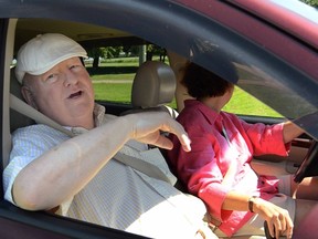 Senator Mike Duffy speaks while in his vehicle outside a pet kennel in Kensington, Prince Edward Island July 18, 2014. Once a close political ally of Prime Minister Stephen Harper, 31 criminal charges have been laid against Duffy, in the latest development in a long-running scandal that has hurt support for Harper's right leaning Conservative government ahead of an election scheduled for October 2015.  REUTERS/Andrew Collins  (CANADA - Tags: POLITICS)