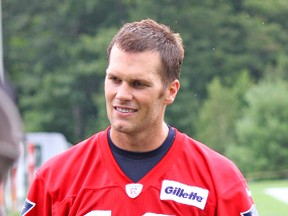 Quarterback Tom Brady (12) at the New England Patriots' practice fields adjacent to Gillette Stadium in Foxboro, Mass. (John Kryk/QMI Agency)