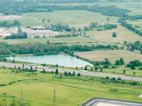 An aerial photograph looking southeast of land owned by PenEquity that they want to develop along Hwy. 401 west of Wellington Rd. in London. (Free Press file photo)