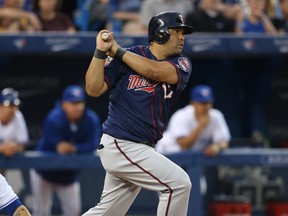 Minnesota Twins designated hitter Kendrys Morales (17) hits a double in the fifth inning against the Toronto Blue Jays at Rogers Centre on Jun 10, 2014 in Toronto, Ontario, CAN. (Tom Szczerbowski/USA TODAY Sports)