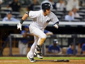 New York Yankees centre fielder Jacoby Ellsbury (22) hits an RBI single against the Texas Rangers during the thirteenth inning of a game at Yankee Stadium on July 22, 2014. (BRAD PENNER/USA TODAY Sports)