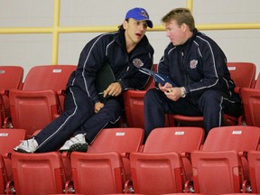 Rocky Thompson, left, now an assistant coach with the Edmonton Oilers, shown here in discussion with Larry Pleau, has gone a long way from his days of playing bantam Triple A hockey in the Grove. - QMI Agency