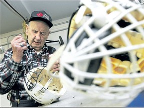 Russ Barnes repairs hockey helmets while volunteering at The Brick Sport Central. Sport Central collects and repairs donated sporting equipment that it then distributes to underprivileged children. (File photo)