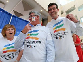 Heather Klimchuk (left), Reg Milley (centre), and Mayor Don Iveson wear an Edmonton 2022 T-shirt after announcing the city's bid for the 22nd Commonwealth Games Edmonton city hall on July 1, 2014. Milley is heading up the bid. (Perry Mah/QMI Agency)