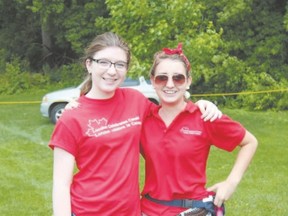 Abby Ouellette, left, and Cassandra Haggarty volunteered at the London Celebrates Canada event on Canada Day in Harris Park. Many activities went on during the day, capped by a fireworks display attended by some 40,000 people. (Submitted photo)