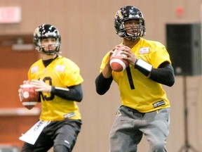 Quarterbacks Henry Burris (right) and Dan LeFevour (left) were teammates in Hamilton for two seasons. Today they go head-to-head as opponents. QMI FILE