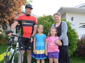 From left: Simon Hajjar, daughters Vienna and Olivia, and wife Staci. Simon, who lives in Stony Plain, was diagnosed with cancer in 2010, he will participate in the Enbridge Ride to Conquer Cancer for the first time this year.  - Thomas Miller, Reporter/Examiner