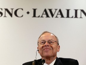 Robert G. Card, president and chief executive officer of SNC-Lavalin, smiles while addressing the media following their annual general meeting in Montreal, May 8, 2014. SNC-Lavalin Group Inc, Canada's largest engineering and construction company, reported quarterly earnings that exceeded expectations on Thursday and raised its 2014 forecast in light of a C$3.2 billion ($2.94 billion) deal to sell its AltaLink electricity transmission system. REUTERS/Christinne Muschi (CANADA - Tags: BUSINESS CONSTRUCTION)