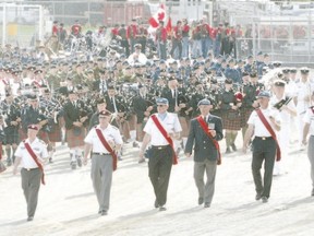 A Warrior?s Day parade from years past marches at Western Fair grounds. (File photo)