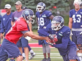 Argos QB Ricky Ray hands off to Anthony Coombs during practice earlier this week ahead of tonight’s game in Regina. (DAVE THOMAS/Toronto Sun)