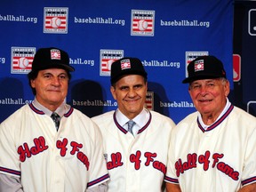 Hall of Fame-bound managers (from left) Tony La Russa, Joe Torre and Bobby Cox pose for a photo on Dec. 9 after it was announced they would be inducted. (USA TODAY SPORTS)