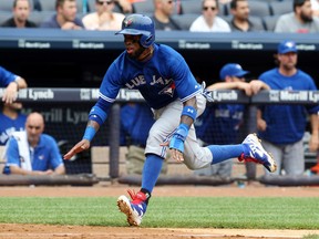 Blue Jays shortstop Jose Reyes scores on a double by Melky Cabrera during fifth inning action against the Yankees in New York on Saturday, July 26, 2014. (Noah K. Murray/USA TODAY Sports)